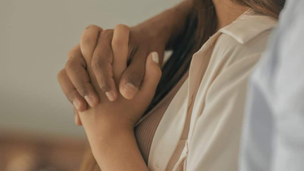 Couple holding hands